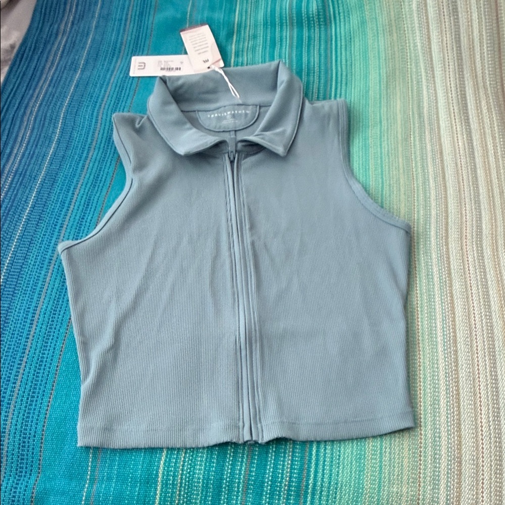 Travis Mathew Smoky Blue Sleeveless Midline Moveknit Polo